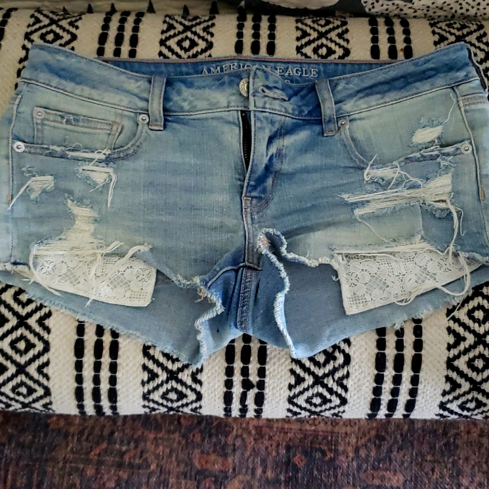 American Eagle distressed faded denim booty shorts